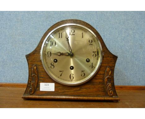 An oak Westminster chime mantel clock 