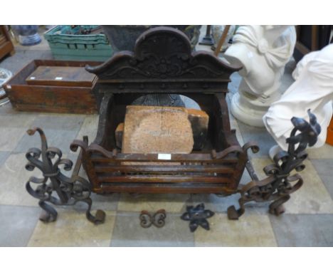 A 19th Century cast iron fire grate and pair of andirons 