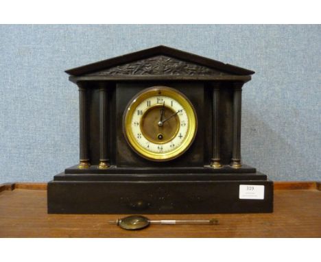 A 19th Century French Belge noir mantel clock 