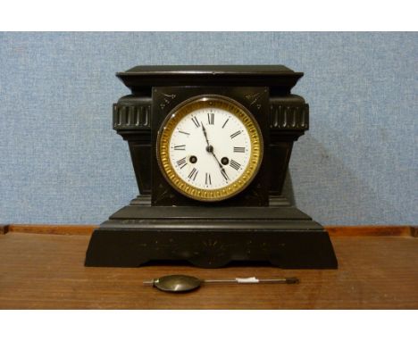 A 19th Century French Belge noir mantel clock 