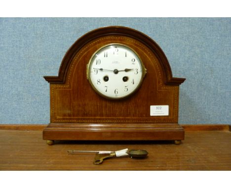 An Edward VII inlaid mahogany mantel clock, the dial signed W.H. May, Nottingham 