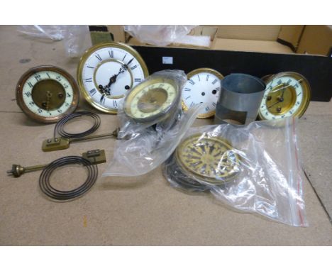 A box of assorted clock parts 