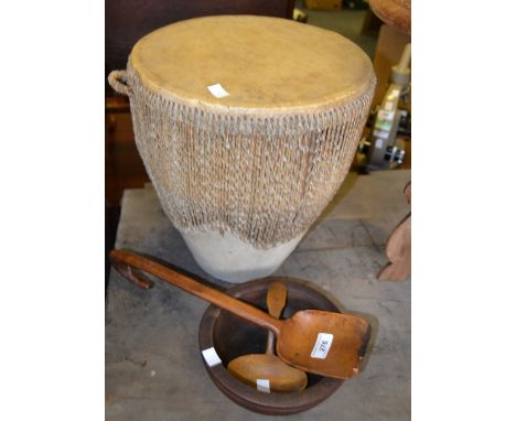 African Art - a leather hide drum, stretched skin drum, hide to sides,  carrying handles to side;  a hand carved elm spoon an