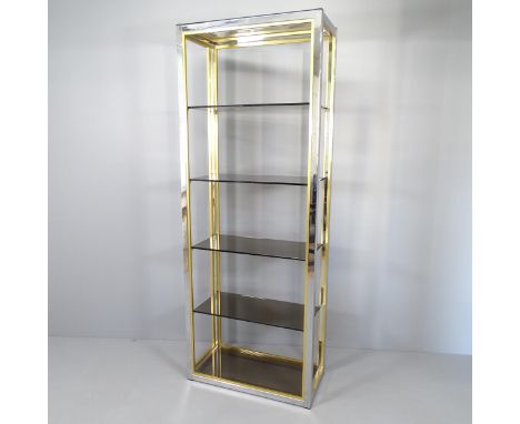 A mid-century Hollywood Regency style display shelf, with chrome and brass frame and six smoked glass shelves, by Renato Zevi