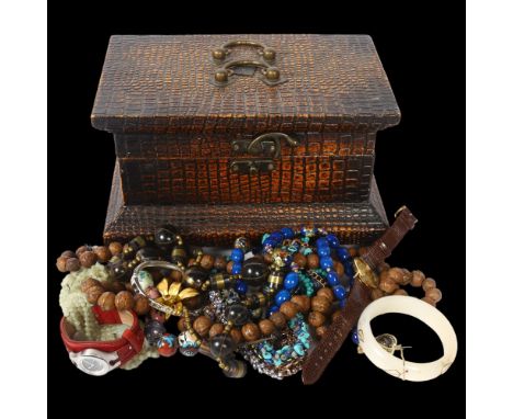 A quantity of costume jewellery, including carved nut necklace, bangle, Fossil wristwatch etc 