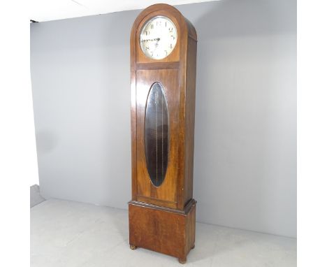 An Art Deco oak and mahogany cased longcase clock with arch top, circular dial labelled Bravington's Ltd., three weights and 