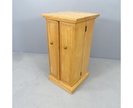 A modern light oak CD cabinet. 40x82x43cm