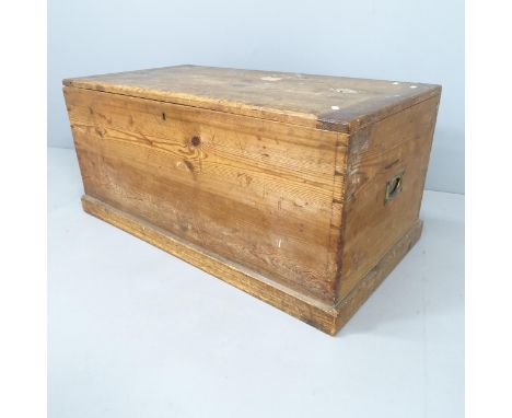 A vintage stained pine trunk, with campaign style brass handles. 99x45x52cm. 