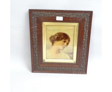 Hand coloured reverse print behind convex glass panel, portrait of a young girl, in original relief moulded frame, overall fr