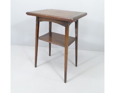 An early 20th century oak fold-over card table. 51x74x38cm. 