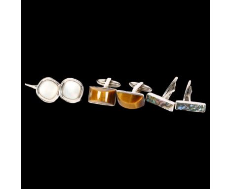 A pair of tigers eye set cufflinks, a pair of mother-of-pearl set cufflinks, and a pair of abalone set cufflinks 
