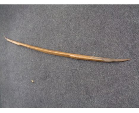 An antique rustic twin bladed tool