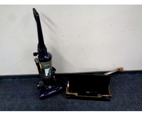 A Samsung upright vacuum together with a box containing Bush LCD TV, bathroom scales, contemporary table lamp and a bull work