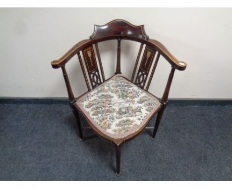 An Edwardian beech corner chair with a tapestry upholstered seat 