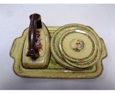 A mid 20th century Chad Valley tin plate toy iron tray, and three and four tea plates  