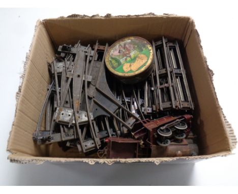 A box containing a vintage Hornby clockwork tin plate train set  