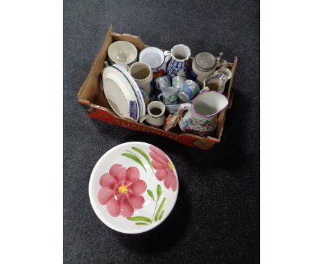 A box containing German beersteins, wash jug and basin, Newcastle jug etc 