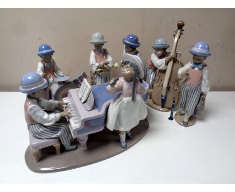 A six piece Lladro Jazz Band - 5832 jazz horn, 5833 jazz sax, 5834 jazz bass, 5929 jazz drums, 5930 jazz duo and 5928 jazz cl