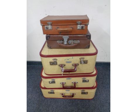 A set of three 20th century airport lightweight luggage cases together with two further vintage leather luggage cases 