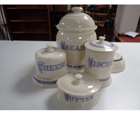 A Ditto blue and cream lidded bread bin biscuit barrel, butter and cheese dish, together with a further ceramic lid 