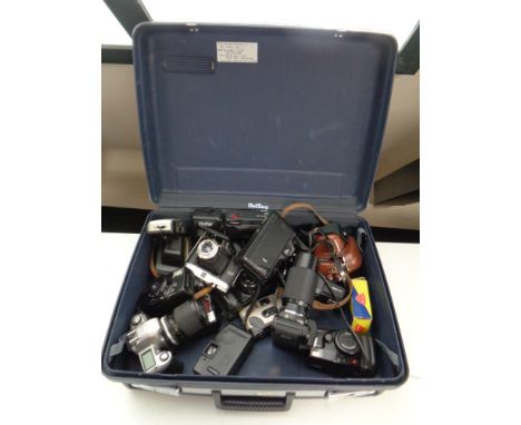 A Delsey luggage case containing a large quantity of assorted vintage and later cameras to include Pentax, Canon, Nikon, Olym