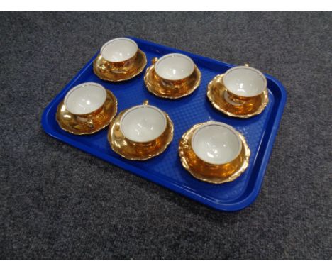 A set of six Bavarian gilded tea cups with saucers 