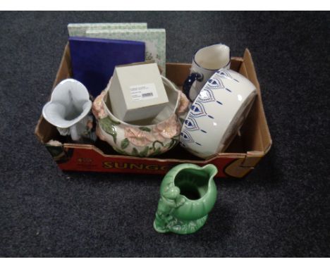 A box containing assorted ceramics to include Royal Doulton Christmas plate, Sylvac vase, wash jug and basin, ceramic table l