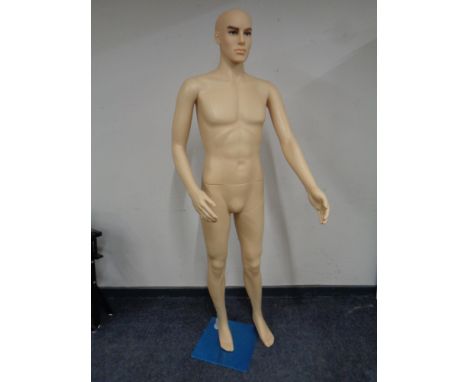 A male shop mannequin on stand