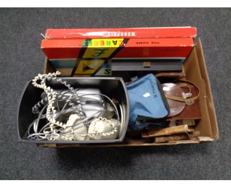 A box containing board games, cameras, telephones, table lamp base, binoculars, two antique volumes Pope's Works  
