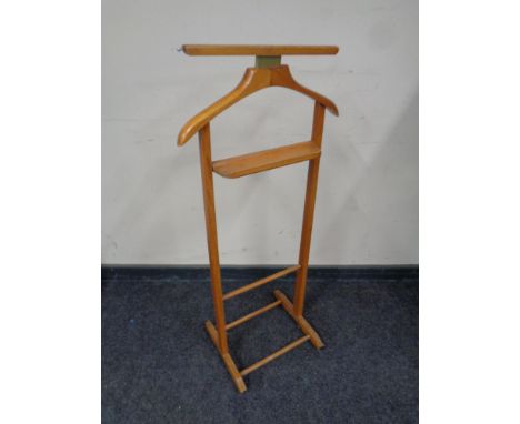 A wrought iron wall hanging plant trough together with a valet stand  
