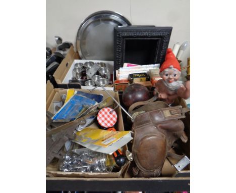 Two boxes containing miscellaneous to include stainless steel tea ware, vintage hair clipper boxes, folded maps, cast iron co