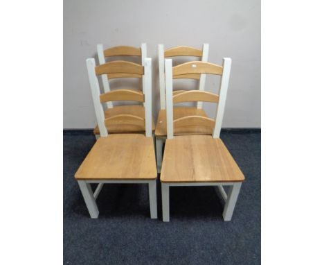 A set of four contemporary pine ladder back dining chairs  