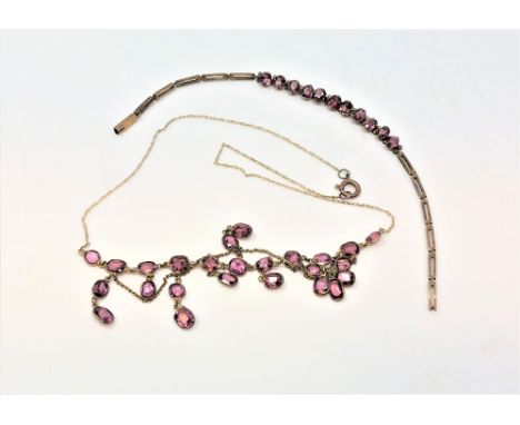 An Edwardian yellow metal mounted necklace with matching bracelet, set with amethyst.