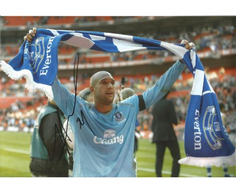 Football Tim Howard signed 12x8 colour photo pictured celebrating during his time with Everton. Timothy Matthew Howard (born 