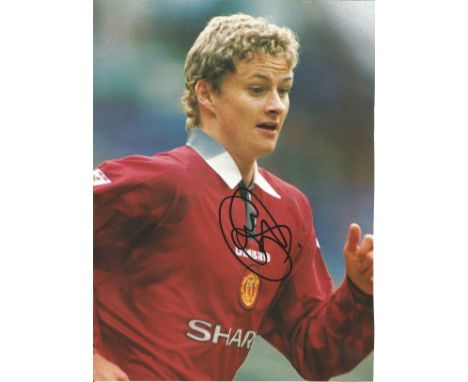 Football Ole Gunnar Solskjær signed 10x8 colour magazine photo pictured playing for Manchester United. Good condition. All au