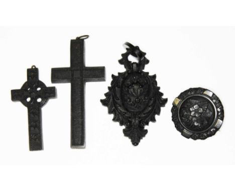 Victorian jet jewellery comprising a Celtic cross , another cross, a pendant locket and a brooch. 