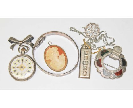 A mixed lot comprising a hallmarked silver bangle and a hallmarked silver ingot pendant, a Continental silver lapel watch, a 