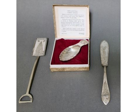 A silver caddy spoon, hallmarked for 1977, Birmingham, David Hollander &amp; Son, gross weight 19.90 grams together with 2 ot