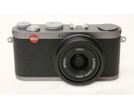 A Leica X1 digital camera, steel grey, with Elmarit 1:2.8/24 ASPH lens, serial no. 3815631, instructions, two batteries &amp;