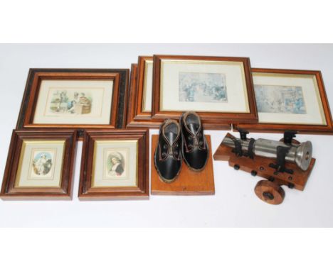 A mini cannon on stand, vintage Lancashire clogs on stand and a selection of pictures to include two framed silk cards and a 