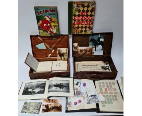 Two vintage cases containing various militaria, pictures, stamps and vintage autograph booklets 