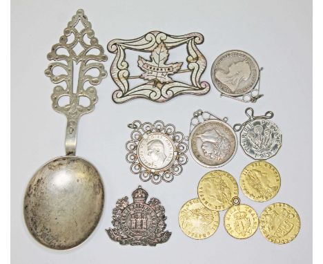 A mixed lot including a Continetal spoon marked '800' and also with pseudo marks, gilt metal gaming tokens, silver coins, an 