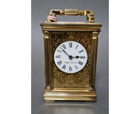 A Mappin & Webb gilt brass carriage clock with key.Condition:- general wear with no sign of any major damage or repair, winds