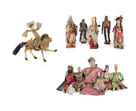 A Chinese Marionette, with painted head, articulated limbs and silk costume; Eight Various Chinese Dolls; Two Articulated Woo