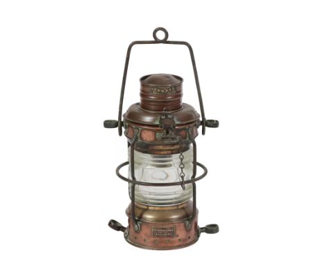 A Copper and Brass 'Anchor' Lamp, by Simpson Lawrence &amp; Co, Glasgow, of cylindrical form with suspension loop and caged c