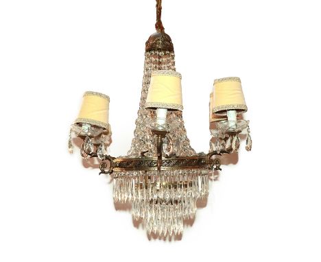 A French Gilt Metal and Cut Glass Six-Light Chandelier, with three cast circular collars, scroll branches and domed boss hung