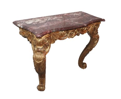 An Early 19th Century Gilt and Gesso Console Table, the later pink and white serpentine marble top above a richly carved C sc