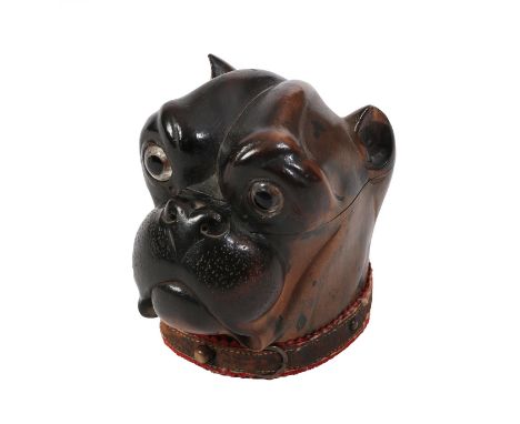 A 19th Century Carved and Stained Fruitwood Inkwell, in the form of a bulldog's head, with glass eyes, and plaque to the back