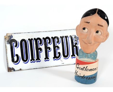 An RH&amp;S Limited Terracotta Hairdressing Advertising Plaque, modelled and painted as a smiling head above a bowtie, incise