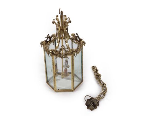 A Late Victorian Brass Lantern of Hexagonal Form, the central plain shaft issuing three nozzles, the frame with cast laurel l